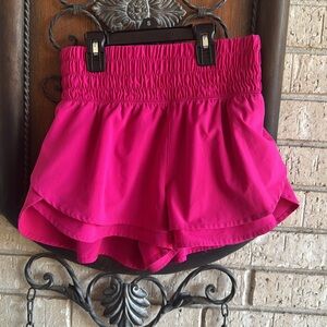 Pink Athletic Shorts with Elastic Waistband and Flowy Design